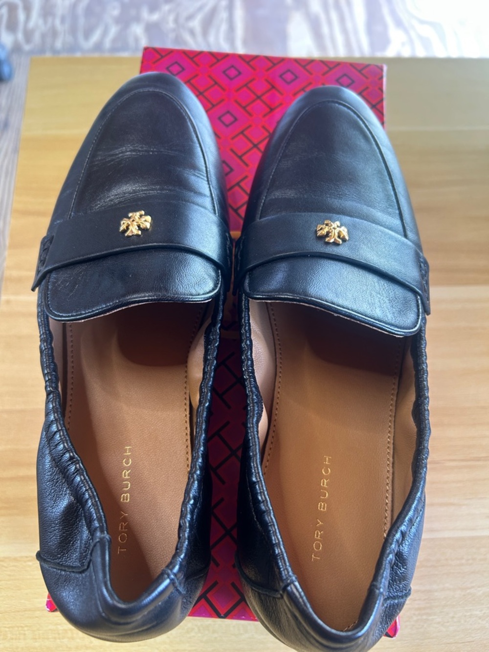 Tory Burch Black Leather Slip-On Loafers with Gold Emblem